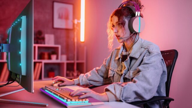 Young woman plays video game online and streaming at home
